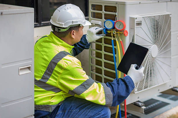 Professional Air Conditioning Repair technician working in Newhall, IA